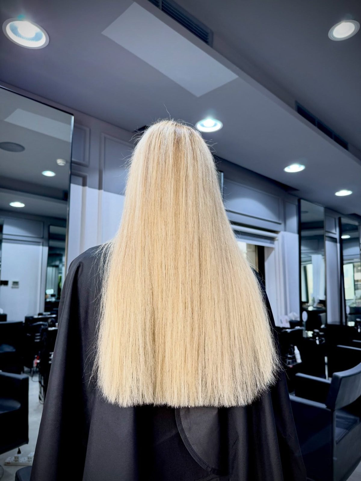 Blonde hair after premium capsule extensions in Dubai